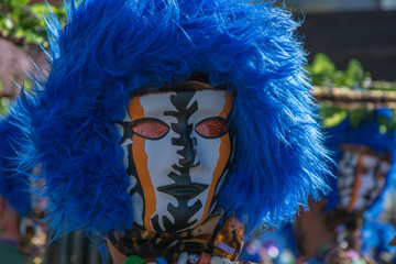 carnival mask with blue feathers, close-up