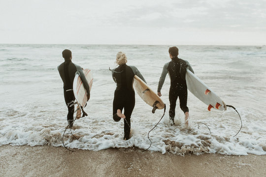 Surfer team at the beach