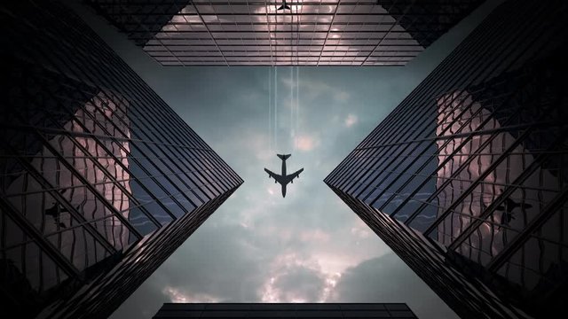 The plane flies over the skyscrapers. Beautiful video composition with cloudy sunset