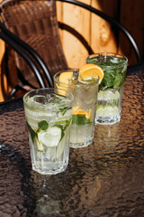 Citrus mojito made from lime and orange. Fresh summer drinks with ice.