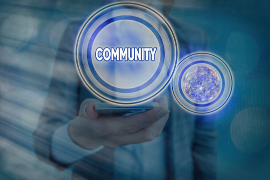 Text sign showing Community. Business photo showcasing group of showing with a common characteristics living together Elements of this image furnished by NASA