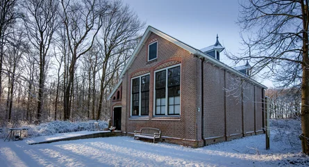 Foto auf Leinwand Old schoolbuilding. Boschoord. Colonial house. Koloniehuisje. Maatschappij van Weldadigheid. Drenthe Netherlands. Winter, Snow © A