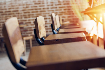 social distancing concept ,A group of empty wooden chairs in a cafe, corona covid-19