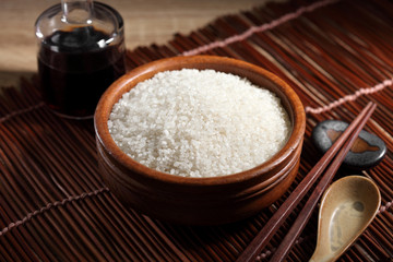 close up Japanese rice in measuring cup on table, Japanese rice in kitchen background