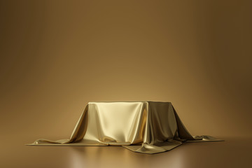 Golden luxurious fabric placed on top pedestal or blank podium shelf on gold background with luxury...