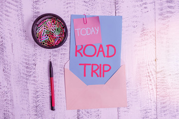 Conceptual hand writing showing Road Trip. Concept meaning long distance journey on the road...