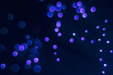 Glowing colored blurred dots. Colored fantasies. Bokeh.