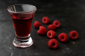 rich alcoholic raspberry tincture in a glass