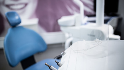 dentist office in the face mask in the foreground