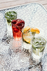 Bright autumn cocktails of lemonade with zirus fruits.
