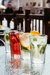 Different types of lemonades with strawberries, citrus, mint. Menu cafe and restaurant. Cold summer drinks.