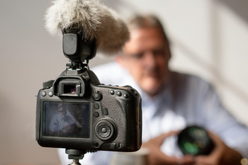 Photographer vlogging about cameras