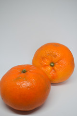 Orange tangerine with peel photographed on a white background,fruits and vitamin c