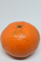 Orange tangerine with peel photographed on a white background,fruits and vitamin c