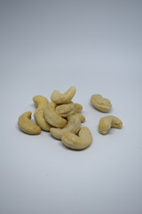 Handful of cashew nuts on a white background, dried fruit