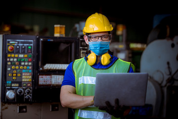 Portrait worker under inspection and checking production process on factory station by wearing...