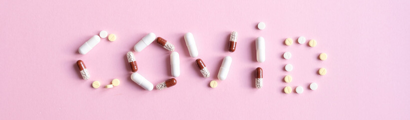 The word covid laid out from tablets