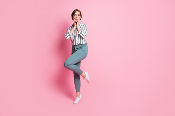 Full length photo of astonished funky youth girl hear incredible information feel stupor scream wow touch hands cheeks wear modern outfit isolated over pink color background