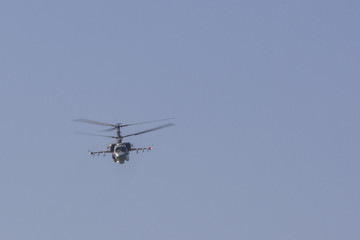 Fototapeta na wymiar Aerobatics on a Ka-52 Hocum-B helicopter