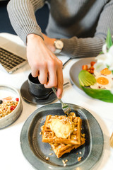 waffles with ice cream on the dining table