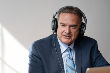 Businessman recording a podcast