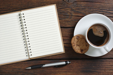 Coffee, cookie and notebook