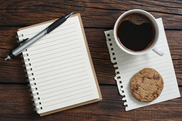 Notebook, coffee and cookie