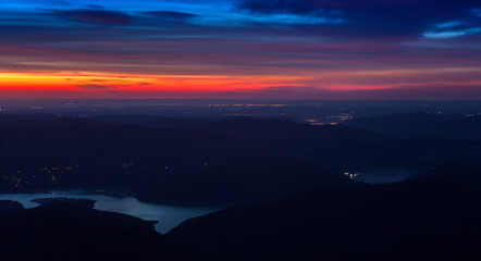 sunset and lake, landscape view from Ceahlau mountain. Romania