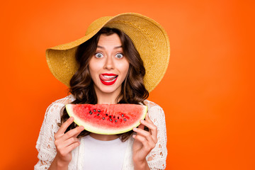 Photo of curly wavy cheerful casual positive nice cap charming white youngster licking her upper...