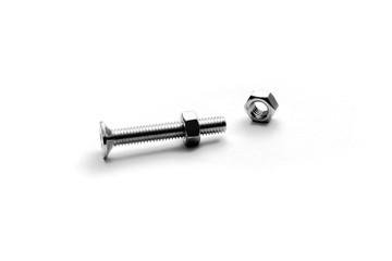 Top view of stainless steel bolts or iron nails on brigth white background with silver color.  Metal screws for use in sheet metal.