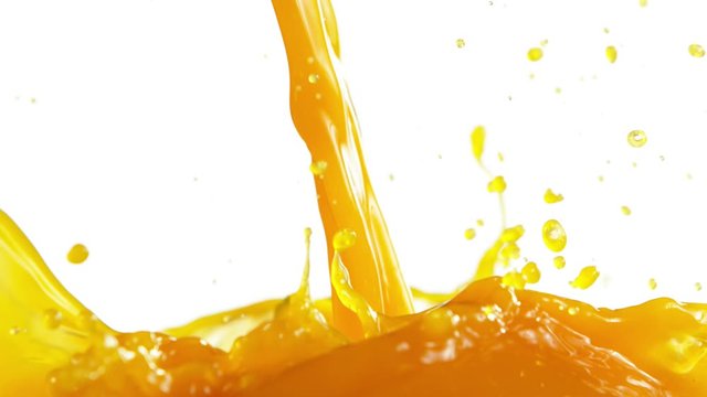Super slow motion of orange slices falling into juice on white. Filmed on high speed cinema camera, 1000 fps.