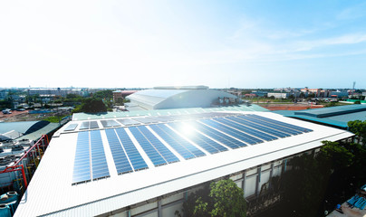 Architectural detail of metal roofing on commercial construction Solar panels or Solar cells on factory rooftop or terrace with sun light, Industry.
