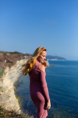 blonde model by the sea at the summer 