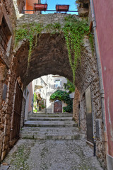 Fototapeta na wymiar A narrow street between the old houses of a medieval village