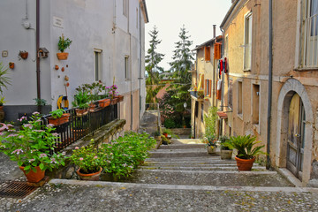 A narrow street between the old houses of a medieval village