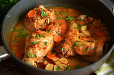 Braised rabbit in gravy in a pan