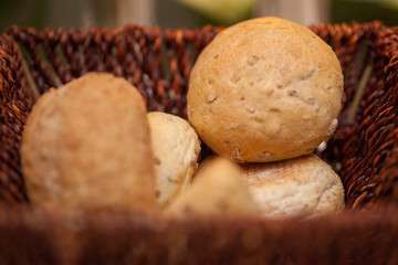  Bunch of sliced French breads and sandwiches in a basket. 