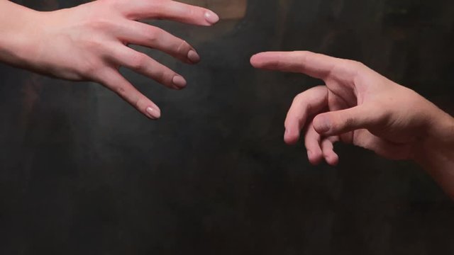 Reworking in the style of Adam's creation, the male and female hand reach out to each other. Parallax effect is a living picture