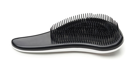 Modern design plastic hairbrush isolated on a white background