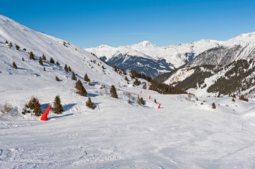 View of a ski slope in alpine winter resort