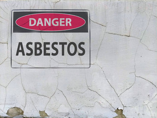 forbidden sign danger asbestos at the plaster asbestos wall