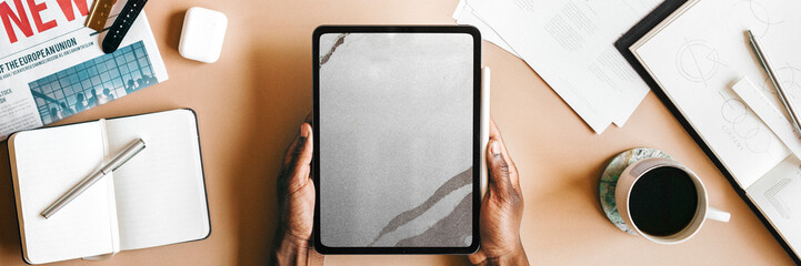 Tablet on a desk flatlay