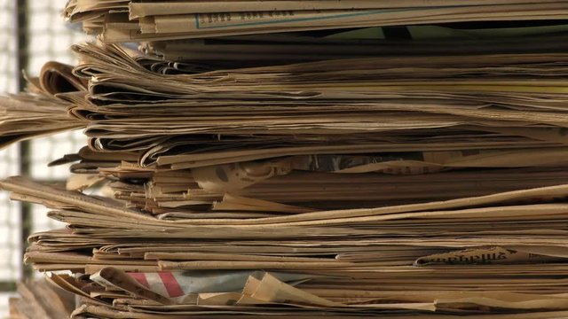 View of old news papers stack , showing from one side to other