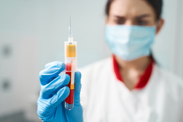 Focused photo on female hand that holding test tube