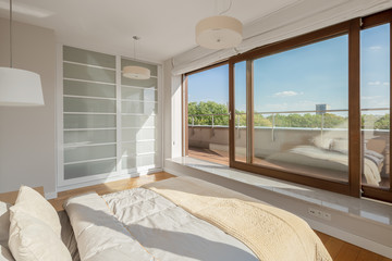 Elegant bedroom with window wall - 339859917