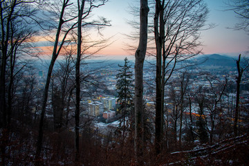 Fototapeta na wymiar Aerial view of Salzburg Austria. Sunset above City with mountains on background 