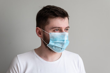 Protection against contagious disease, coronavirus. Man wearing hygienic mask to prevent infection, airborne respiratory illness such as flu, 2019-nCoV. 
