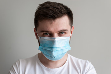 Protection against contagious disease, coronavirus. Man wearing hygienic mask to prevent infection, airborne respiratory illness such as flu, 2019-nCoV. 