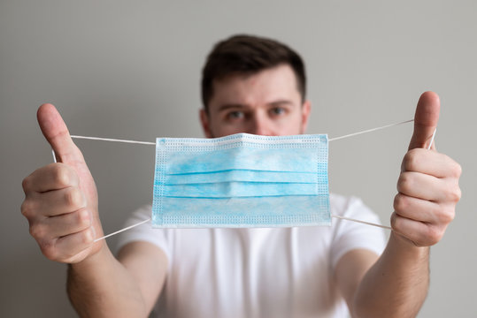 Protection against contagious disease, coronavirus. Man wearing hygienic mask to prevent infection, airborne respiratory illness such as flu, 2019-nCoV. 