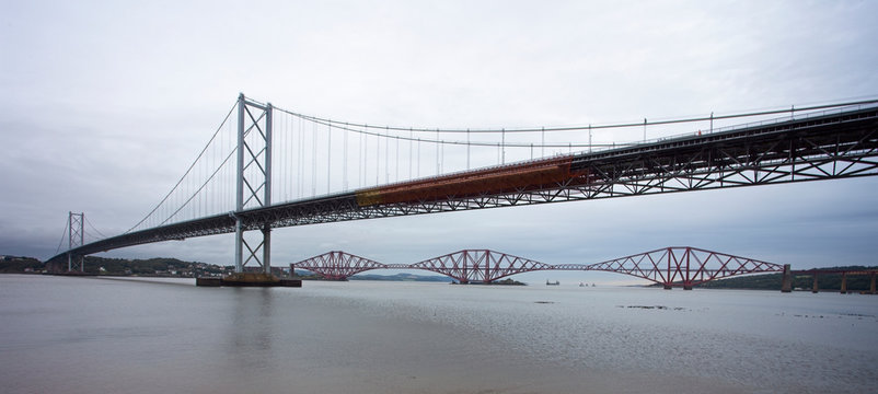 The old Forth Road Bridge, with the Forth Bridge (railway), over the Firth of Forth, West Lothian, Scotland, UK.